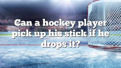 Can a hockey player pick up his stick if he drops it?