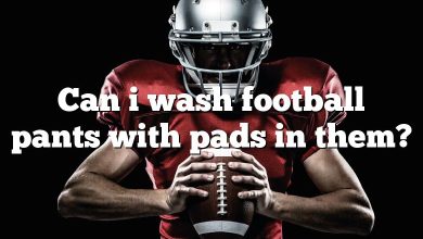 Can i wash football pants with pads in them?
