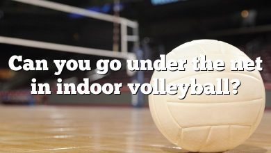 Can you go under the net in indoor volleyball?