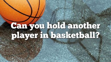 Can you hold another player in basketball?