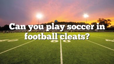 Can you play soccer in football cleats?