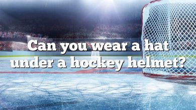 Can you wear a hat under a hockey helmet?