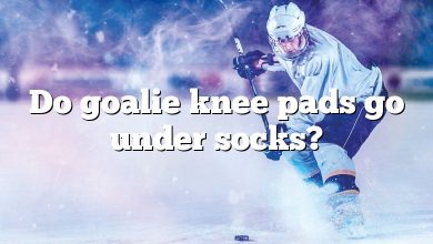 Do goalie knee pads go under socks?