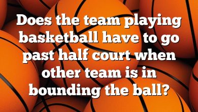 Does the team playing basketball have to go past half court when other team is in bounding the ball?
