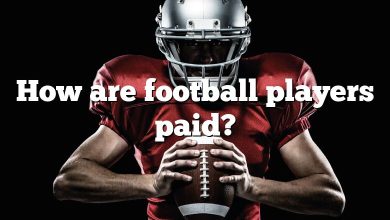 How are football players paid?