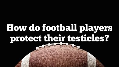 How do football players protect their testicles?