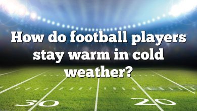 How do football players stay warm in cold weather?