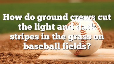 How do ground crews cut the light and dark stripes in the grass on baseball fields?