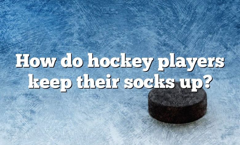 How do hockey players keep their socks up?