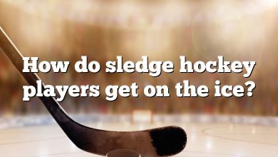 How do sledge hockey players get on the ice?