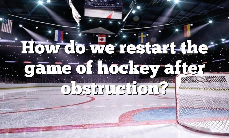 How do we restart the game of hockey after obstruction?