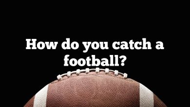 How do you catch a football?