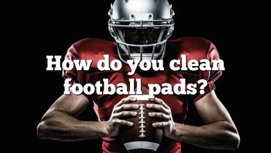 How do you clean football pads?