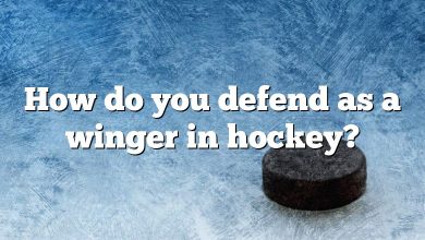 How do you defend as a winger in hockey?