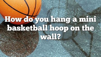 How do you hang a mini basketball hoop on the wall?