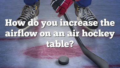 How do you increase the airflow on an air hockey table?