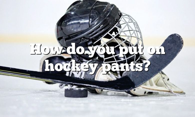How do you put on hockey pants?