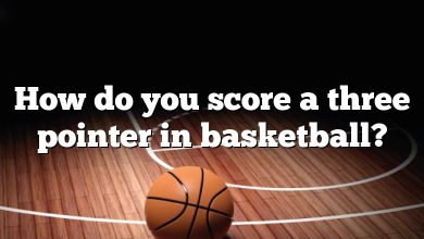 How do you score a three pointer in basketball?