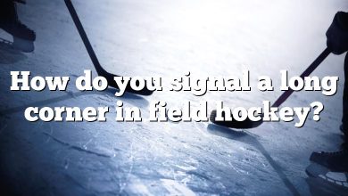 How do you signal a long corner in field hockey?