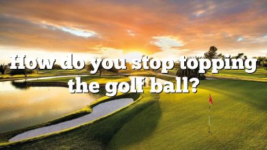 How do you stop topping the golf ball?