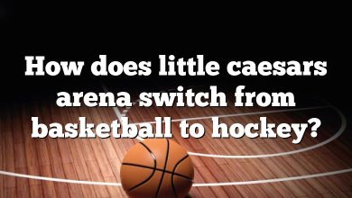 How does little caesars arena switch from basketball to hockey?