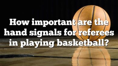 How important are the hand signals for referees in playing basketball?