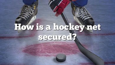 How is a hockey net secured?