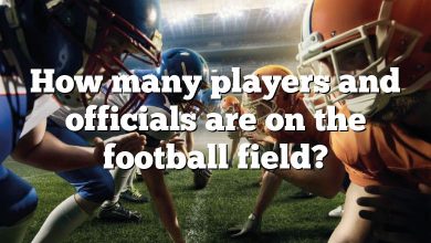 How many players and officials are on the football field?