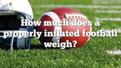 How much does a properly inflated football weigh?