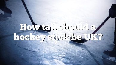 How tall should a hockey stick be UK?