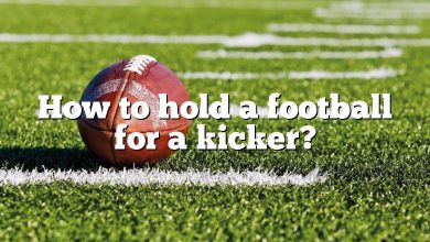 How to hold a football for a kicker?