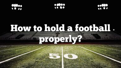 How to hold a football properly?