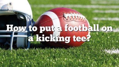 How to put a football on a kicking tee?