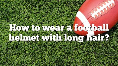 How to wear a football helmet with long hair?