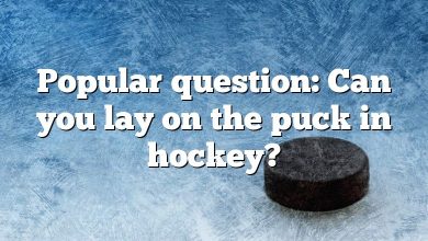 Popular question: Can you lay on the puck in hockey?
