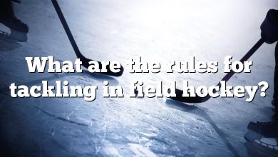 What are the rules for tackling in field hockey?