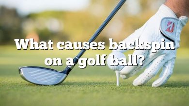 What causes backspin on a golf ball?