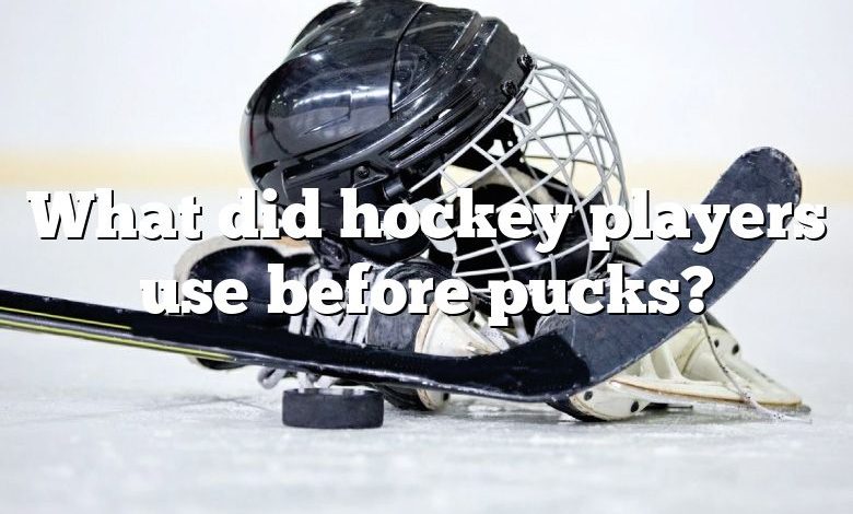 What did hockey players use before pucks?