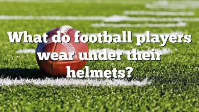 What do football players wear under their helmets?