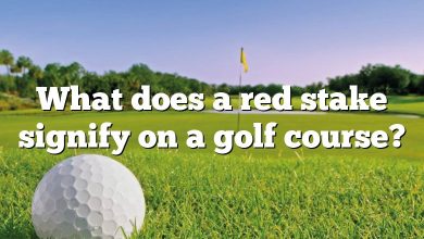 What does a red stake signify on a golf course?