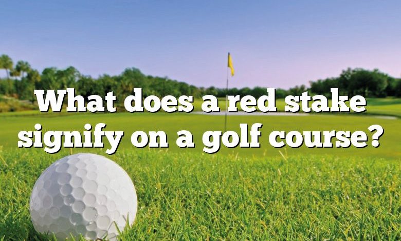 What does a red stake signify on a golf course?