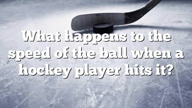 What happens to the speed of the ball when a hockey player hits it?