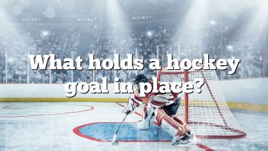 What holds a hockey goal in place?