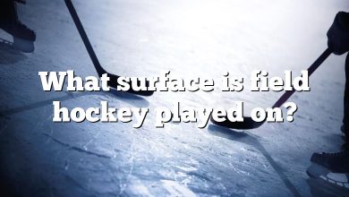 What surface is field hockey played on?