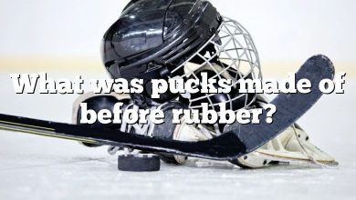 What was pucks made of before rubber?