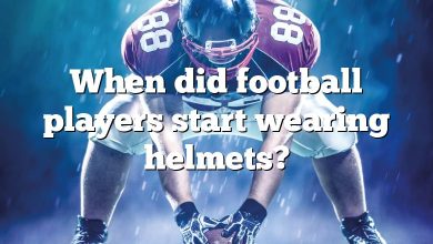 When did football players start wearing helmets?