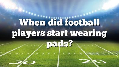 When did football players start wearing pads?