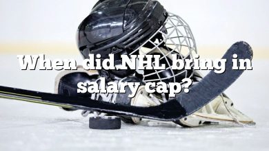 When did NHL bring in salary cap?