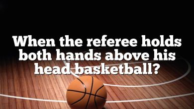 When the referee holds both hands above his head basketball?