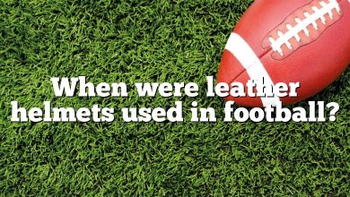 When were leather helmets used in football?